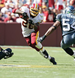 Redskins Football player dodging a tackle