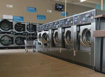 row of high speed washers at seneca express laundry