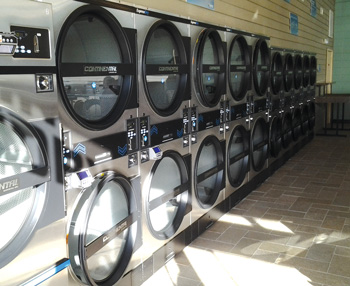 row of high speed dryers at seneca express laundry